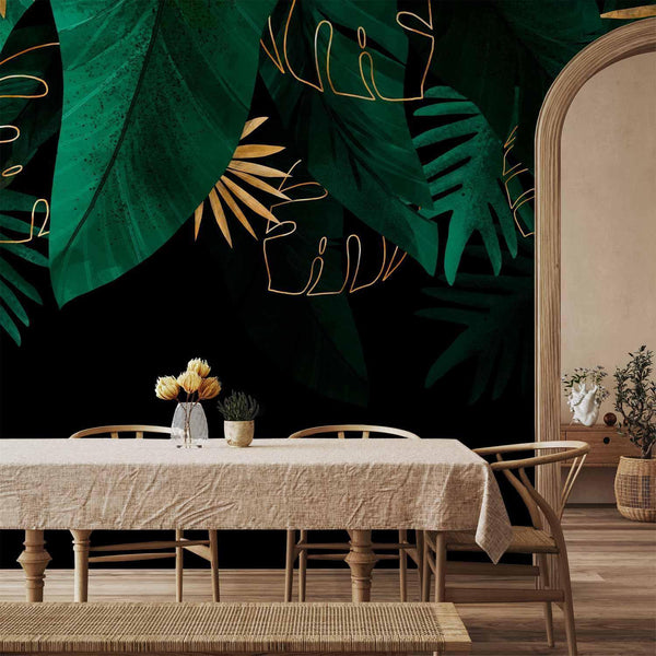 Carta da parati - Jungle and composition - motif of green and golden leaves on a black background