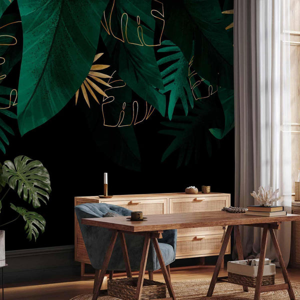 Carta da parati - Jungle and composition - motif of green and golden leaves on a black background